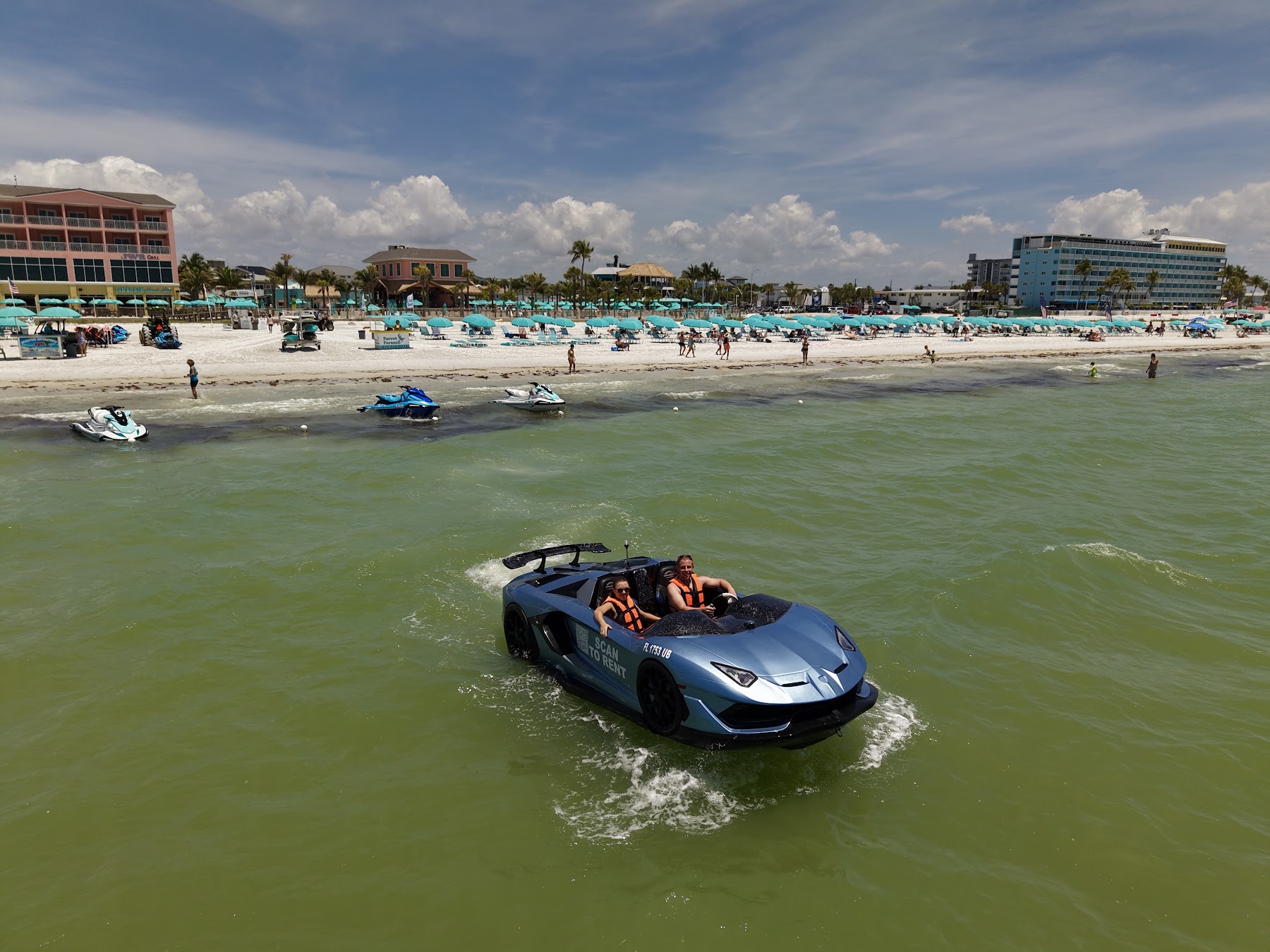 All-inclusive beach day with blue umbrellas at Fort Myers Beach